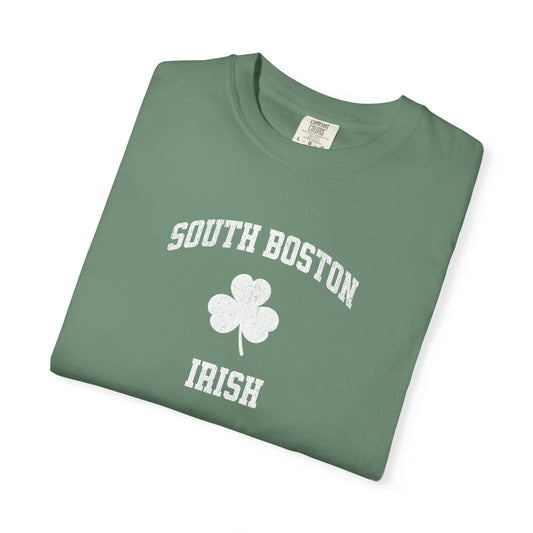Folded green t-shirt with 'South Boston Irish' text and shamrock on a white background
