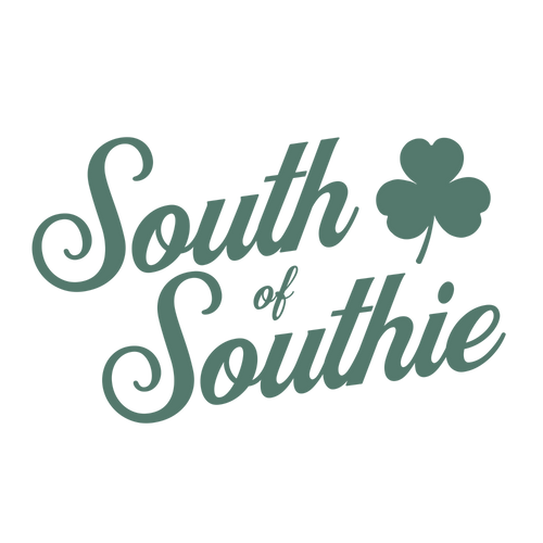 Green "South of Southie' text with a clover leaf on a white background