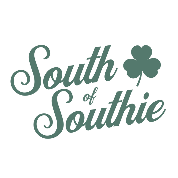 Green "South of Southie' text with a clover leaf on a white background