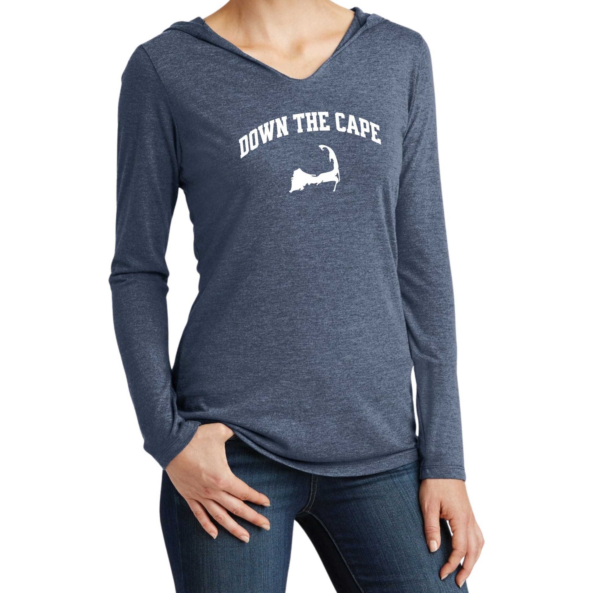 A woman wearing a heathered navy blue long-sleeve V-neck hoodie with a white graphic print that reads 'DOWN THE CAPE' above a silhouette of Cape Cod, paired with dark blue jeans against a plain white background.