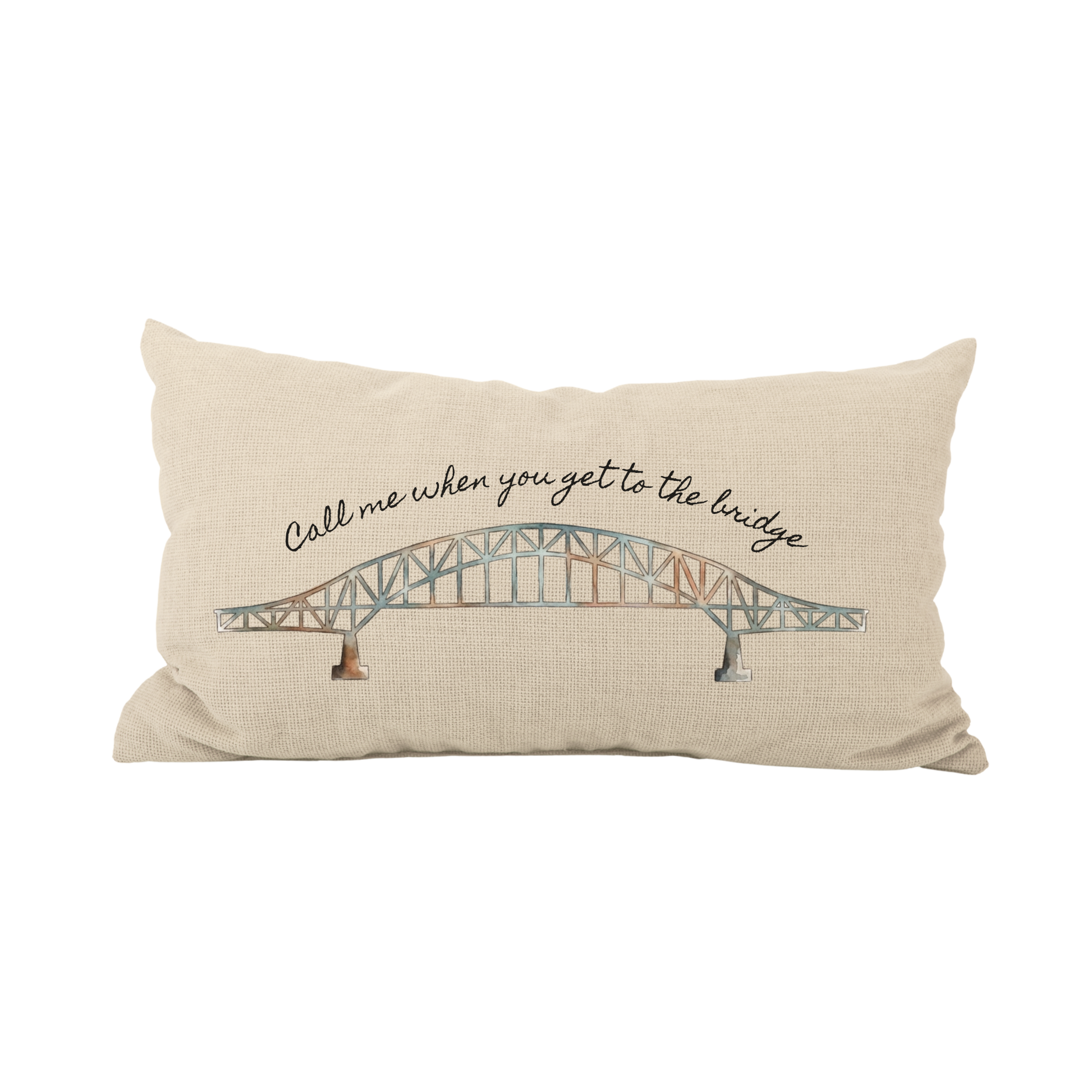 Decorative pillow with a bridge design and text on a beige background