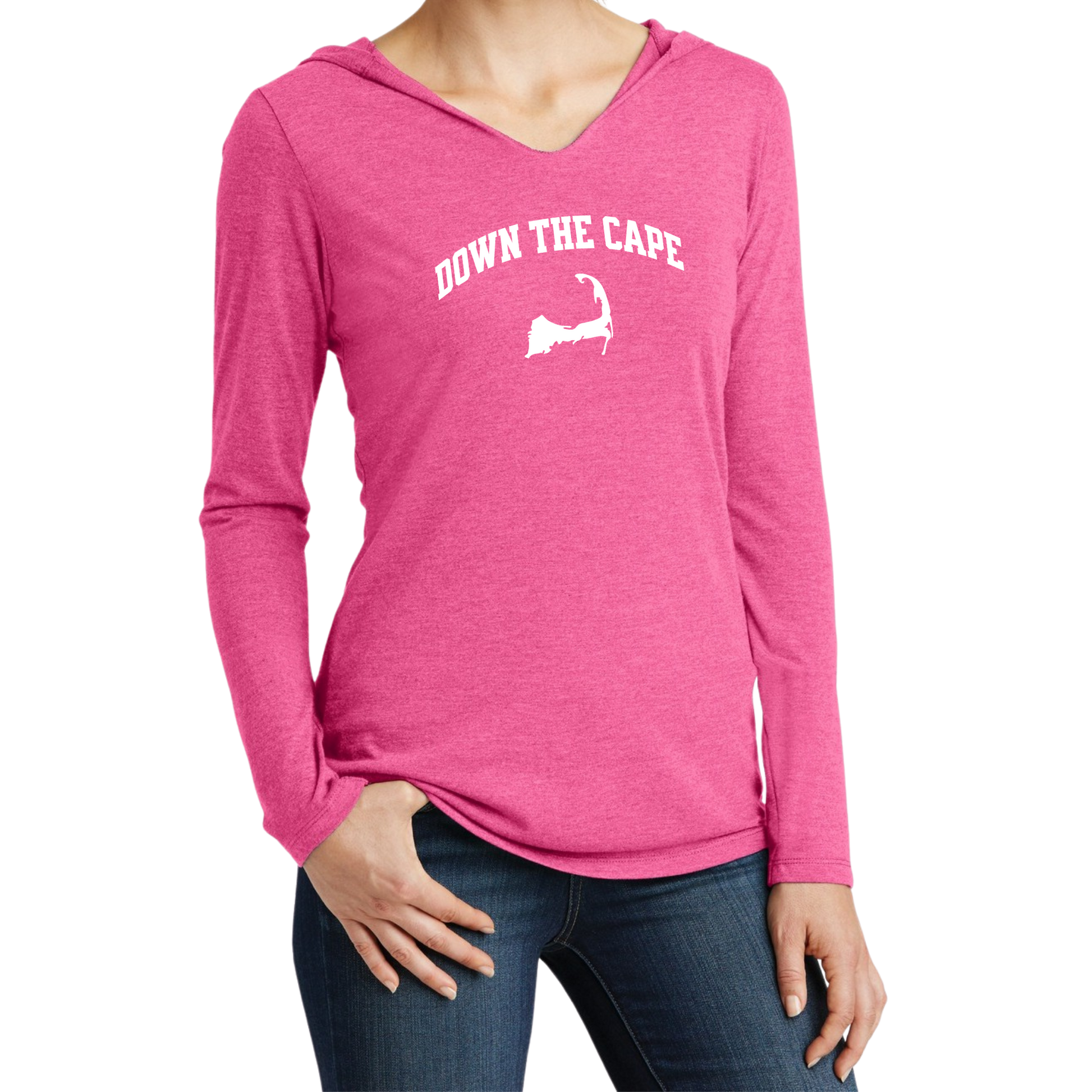 A woman wearing a heather pink long-sleeve V-neck hoodie with 'DOWN THE CAPE.' and a white silhouette graphic on the chest, paired with dark blue jeans, against a plain white background.