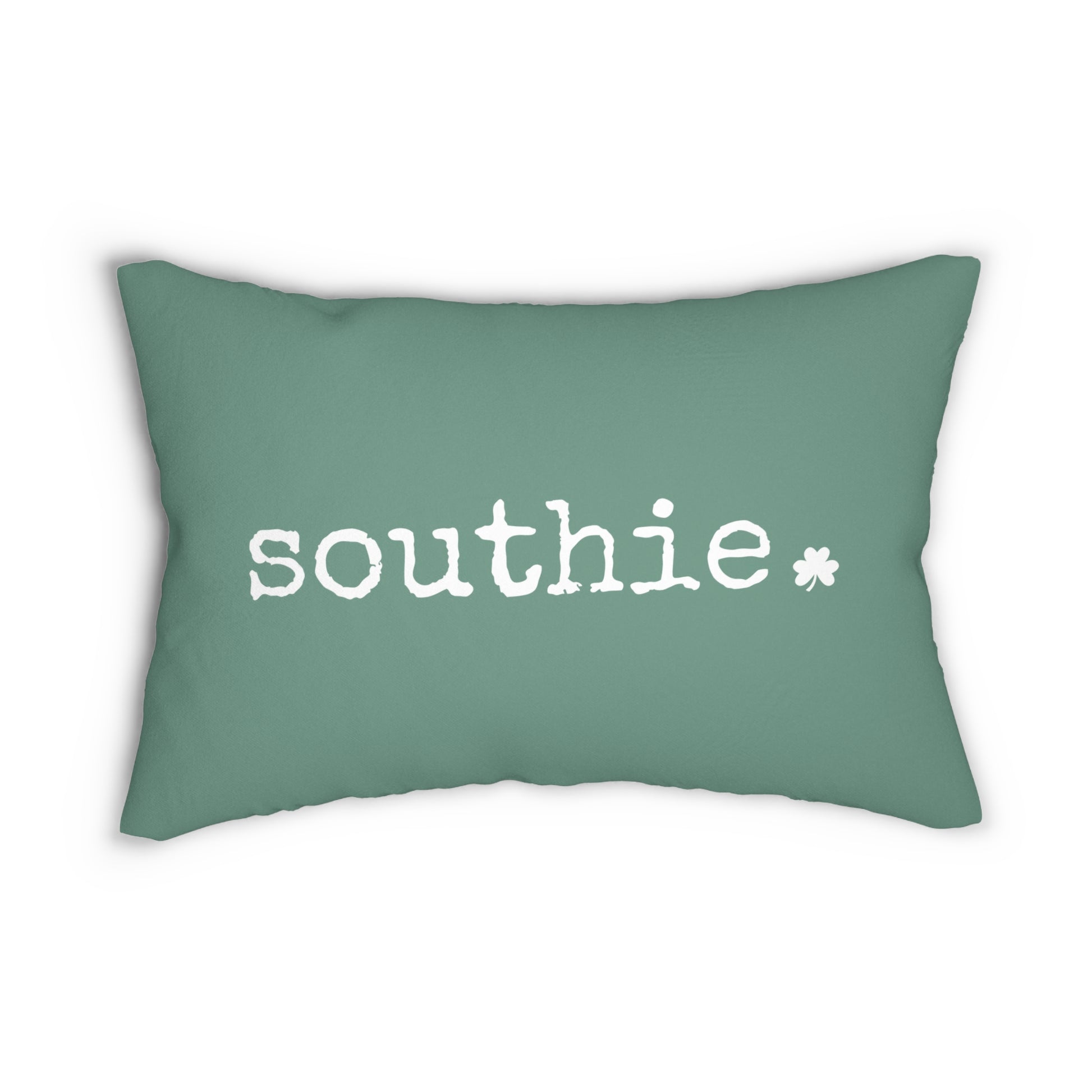 Green pillow with 'southie' text on a white background with a small white shamrock